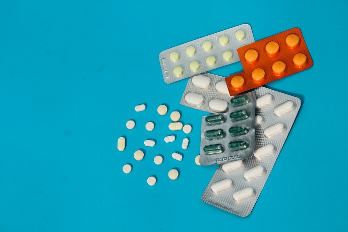 picture of packages of pills on blue background