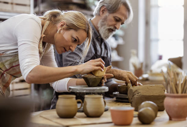 Two People Creating Pottery