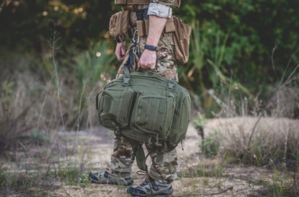 Man holding tactical pouch