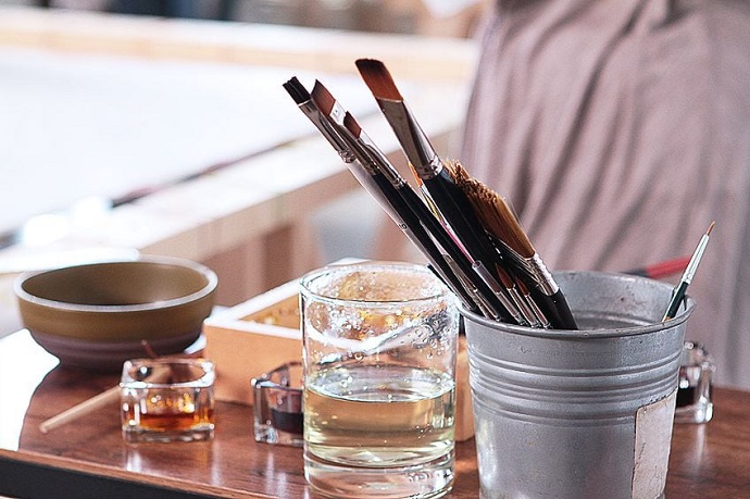 oil painting mediums poured in glasses and brushes