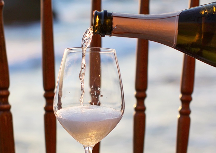 pouring sparkling wine into the glass